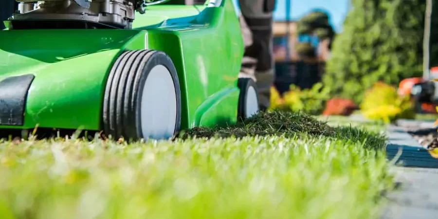 Lawn mower man working in a landscape