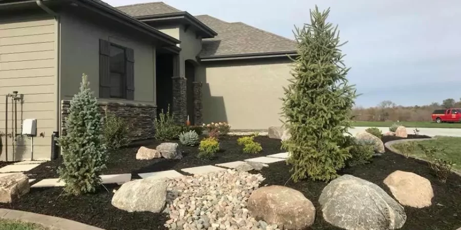 Installed landscape border stone, dry creek beds and mulching